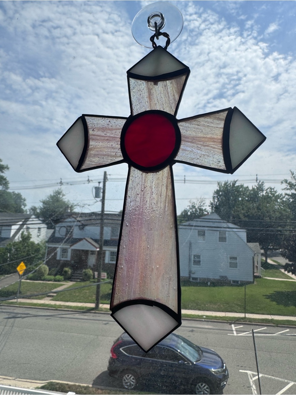 Pink and red stained glass cross